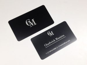 Black business card in metal with silver text