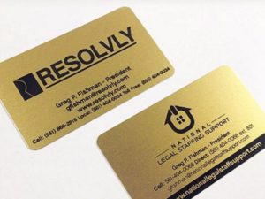 Gold card with black laser burned text